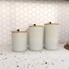 imageDeco 79 Ceramic Living Room Decorative Jars Textured Decorative Container with Wood Lids and Beaded Accents Set of 3 Jar with Lid 9quot 8quot 7quotH White
