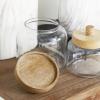 imageDeco 79 Glass Living Room Decorative Jars Decorative Container with Wood Lids Set of 3 Jar with Lid 8quot 9quot 11quotH ClearClear
