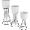 imageDeco 79 Metal Indoor Outdoor Planter Large Planter Pot with Black Hourglass Stands Set of 3 Planters 33quot 27quot 22quot H WhiteWhite