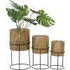 imageCosmoLiving by Cosmopolitan Metal Indoor Outdoor Planter Geometric Cutout Large Planter Pot with Circular Removeable Stands Set of 3 Planters 23quot 19quot 15quotH BlackGold