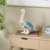 imageDeco 79 Polystone Pelican Decorative Sculpture Textured Home Decor Statue with Red Feathers and Round Blocks Accent Figurine 8quot x 4quot x 13quot RedBlue