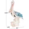 imageDeco 79 Polystone Pelican Decorative Sculpture Textured Home Decor Statue with Red Feathers and Round Blocks Accent Figurine 8quot x 4quot x 13quot RedBlue