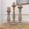 imageDeco 79 Mango Wood Decorative Candle Holder Distressed Turned Pillar Candle Stand Set of 3 Candlestick Holder 18quot 15quot 12quotH Beige