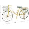 imageDeco 79 Metal Bike Indoor Outdoor Plantstand Indoor Outdoor Wire Floral Scrolled Plant Shelf with Basket and Saddle Bag Planters Plant Stand 56quot x 21quot x 31quot BrownYellow
