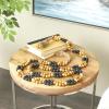 image:imageDeco 79 Mango Wood Handmade Round Double Layered Long Carved Garland with Tassel with Black and Cream Accents 80 x 2 x 2 Brown
